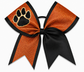 Orange and black cheer bow with a paw print design on a white background